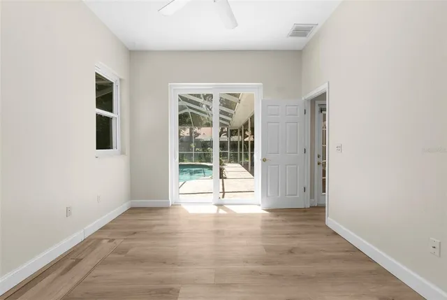 a view of a backyard with a swimming pool