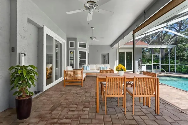 a view of a house with big yard and large trees