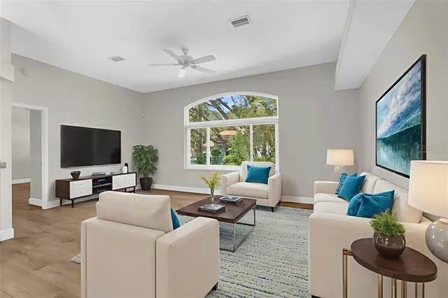 a kitchen with stainless steel appliances granite countertop a stove top oven a sink dishwasher and a microwave oven on the blue kitchen countertops