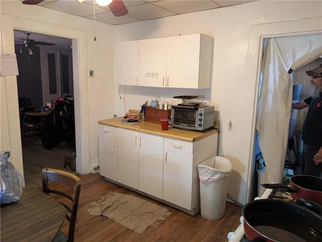 a room with sink and cabinets