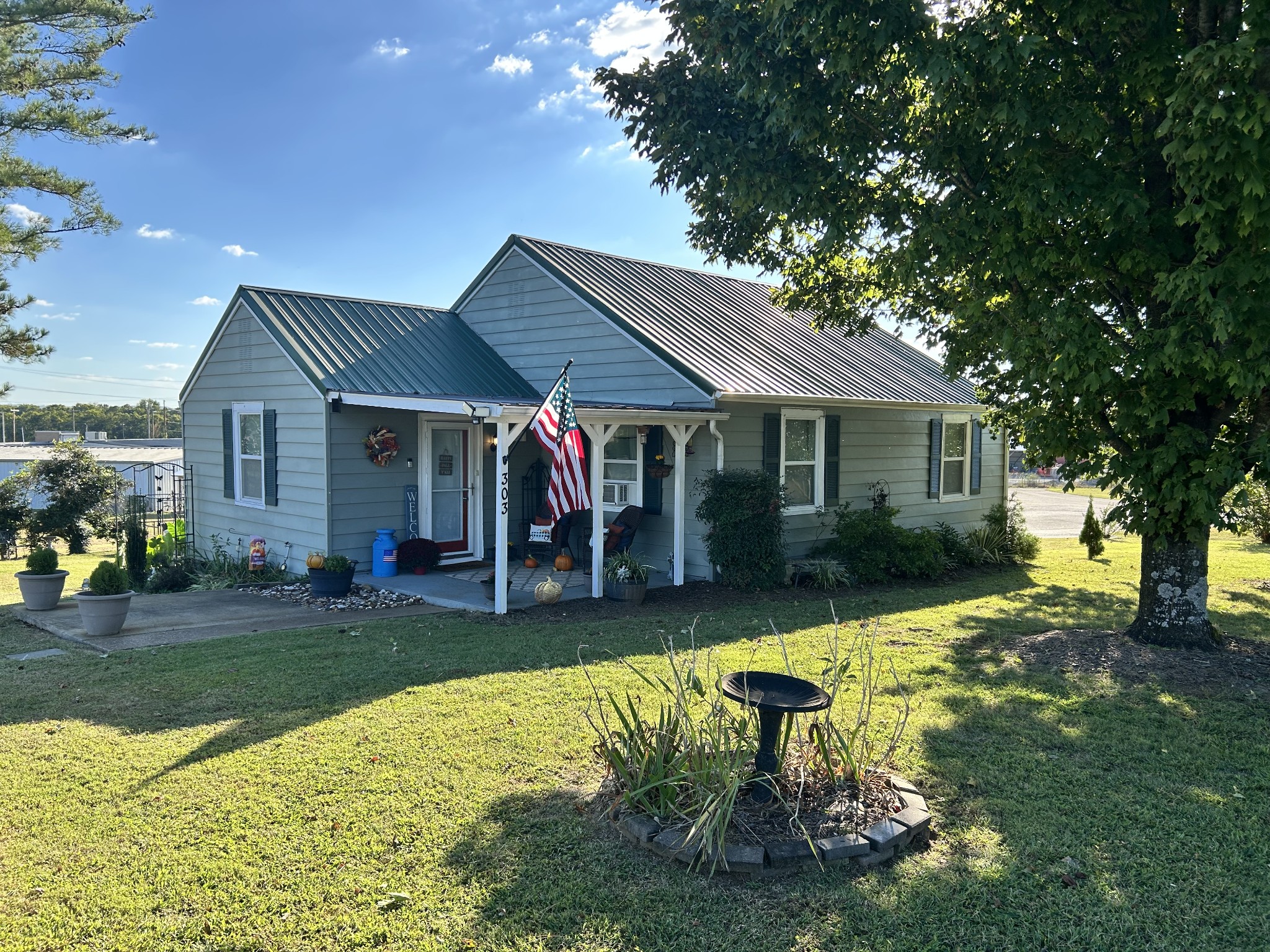 a view of a house with swimming pool and sitting area