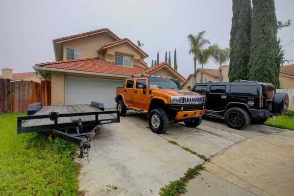 a view of a cars parked in front of a house