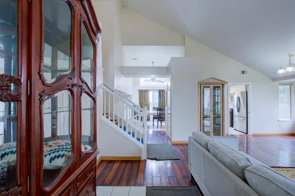 a view of an entryway with wooden floor