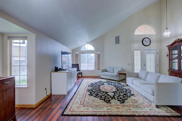 a living room with furniture and a large window