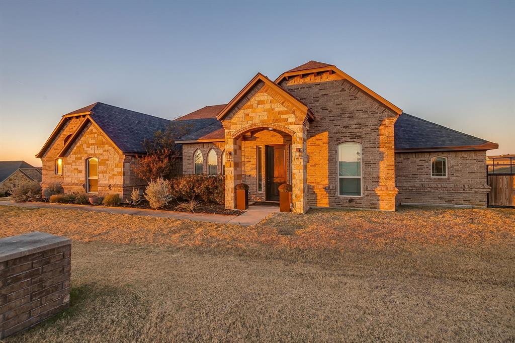 7320 Spring Ranch Court Godley, TX 76044 - Photo 38 of 38 a front view of a house with a yard