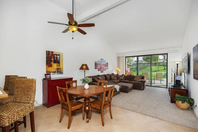 a dining room with furniture and a window