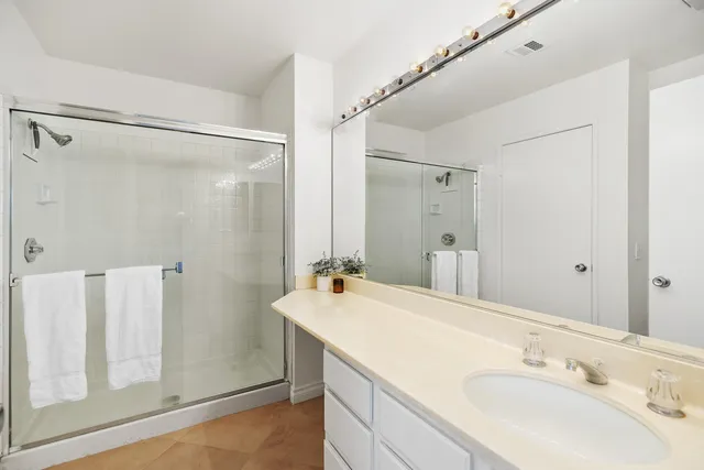 a bathroom with a double vanity sink mirror and double