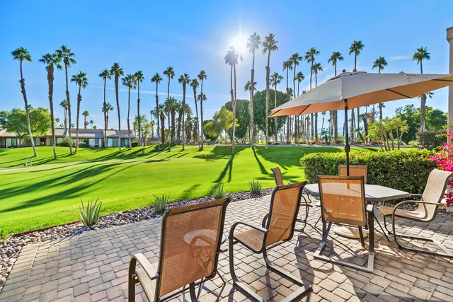 a view of a chairs and table in the patio