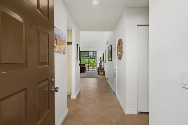 a view of hallway with livingroom