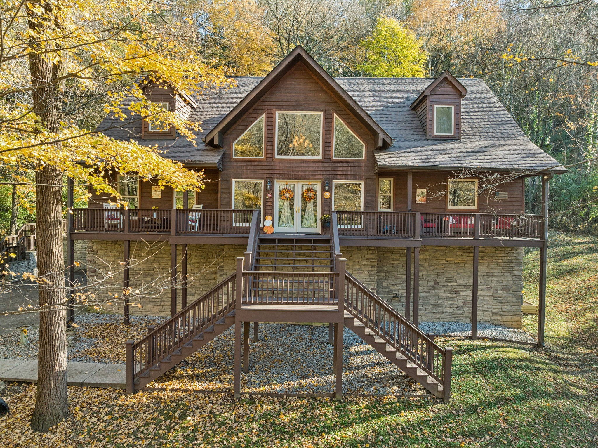 a front view of a house with a yard