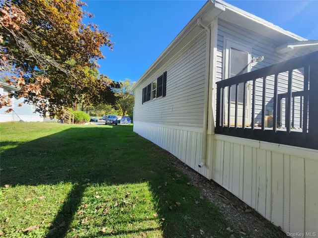 a view of a backyard with large trees