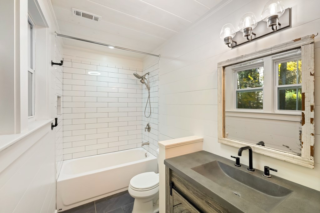 210 East Overbend Trail Blue Ridge, GA 30513 - Photo 12 of 38 a bathroom with a sink toilet bathtub and shower