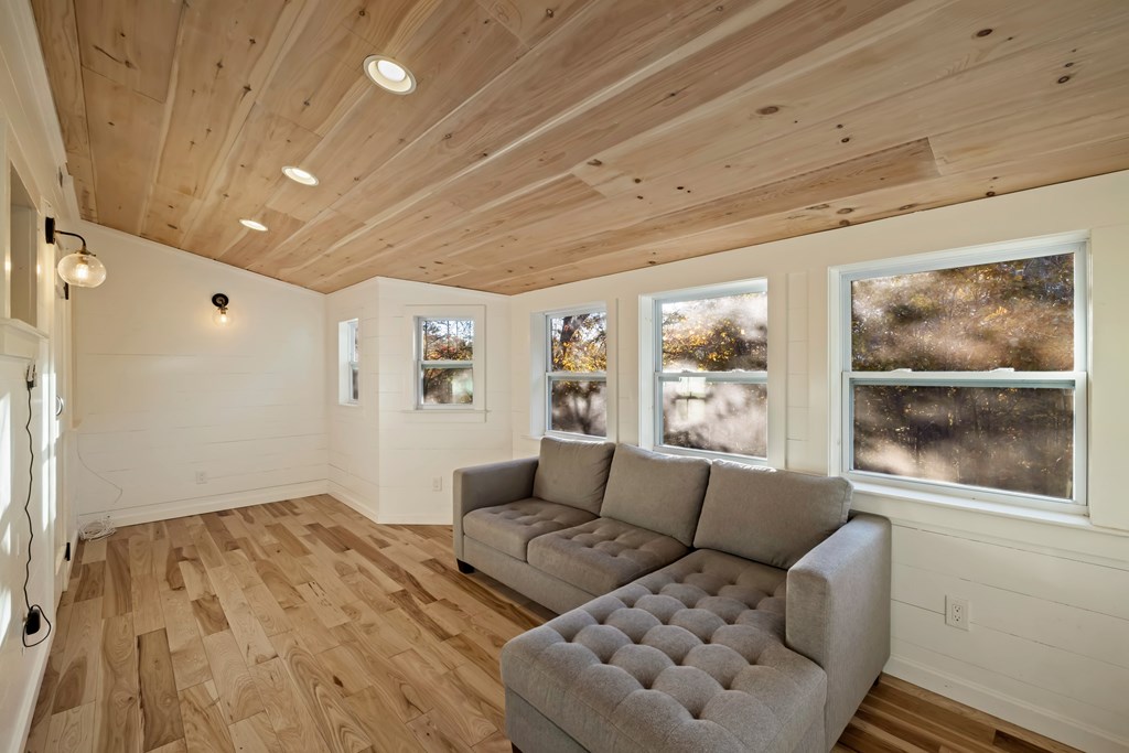 210 East Overbend Trail Blue Ridge, GA 30513 - Photo 14 of 38 a living room with furniture and a large window