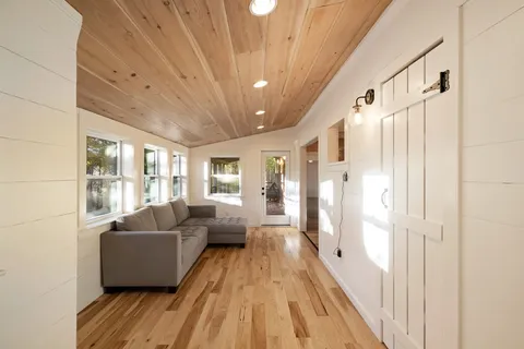 a view of porch with wooden floor