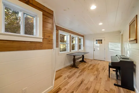 a view of livingroom with furniture wooden floor and window