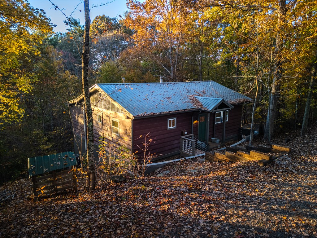210 East Overbend Trail Blue Ridge, GA 30513 - Photo 34 of 38 a view of a house with backyard and sitting area