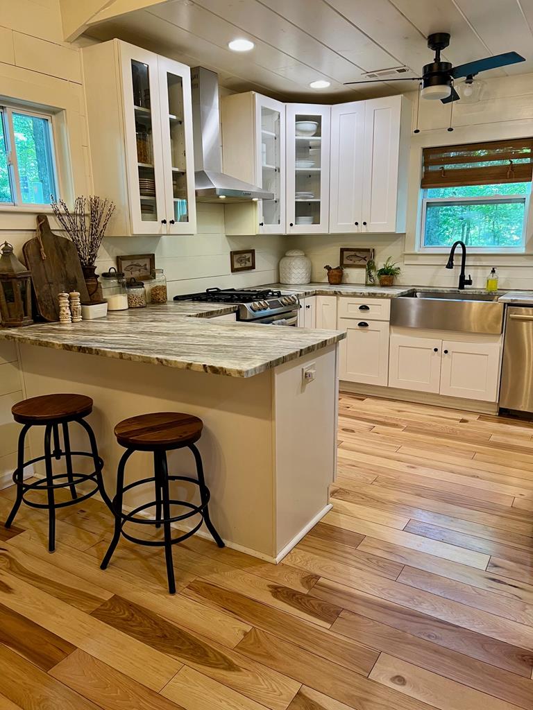 210 East Overbend Trail Blue Ridge, GA 30513 - Photo 39 of 69 a kitchen with stainless steel appliances granite countertop a stove a sink and a refrigerator