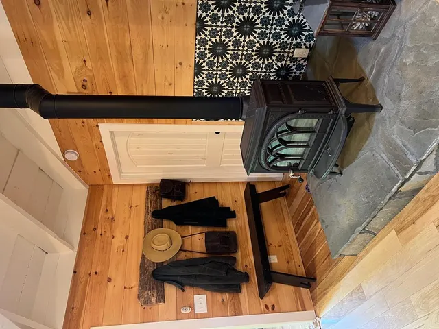 a kitchen with cabinets and wooden floor