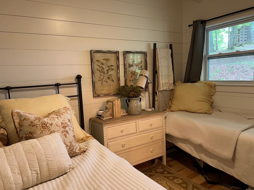 210 East Overbend Trail Blue Ridge, GA 30513 - Photo 57 of 69 a bedroom with a large bed and windows