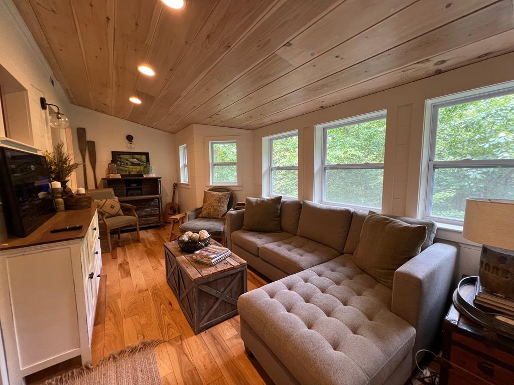 210 East Overbend Trail Blue Ridge, GA 30513 - Photo 59 of 69 a living room with furniture fireplace and a large window