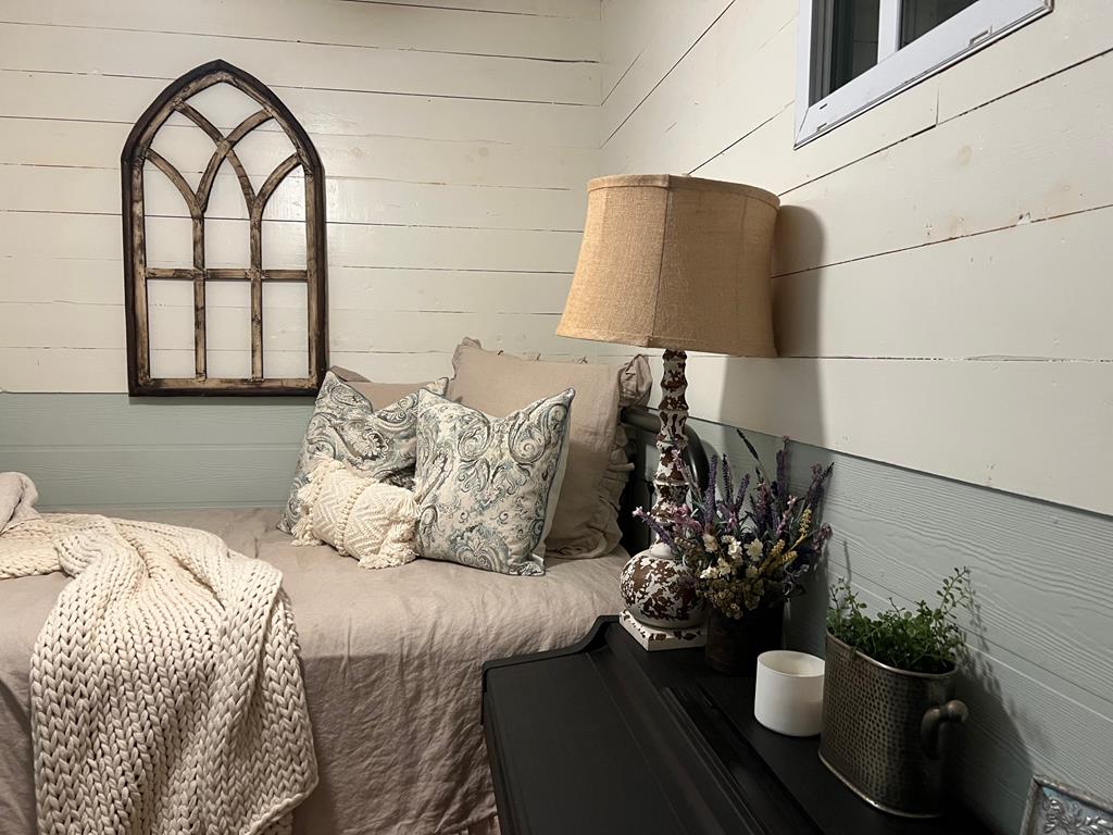 210 East Overbend Trail Blue Ridge, GA 30513 - Photo 65 of 69 a bedroom with a bed and a potted plant on it