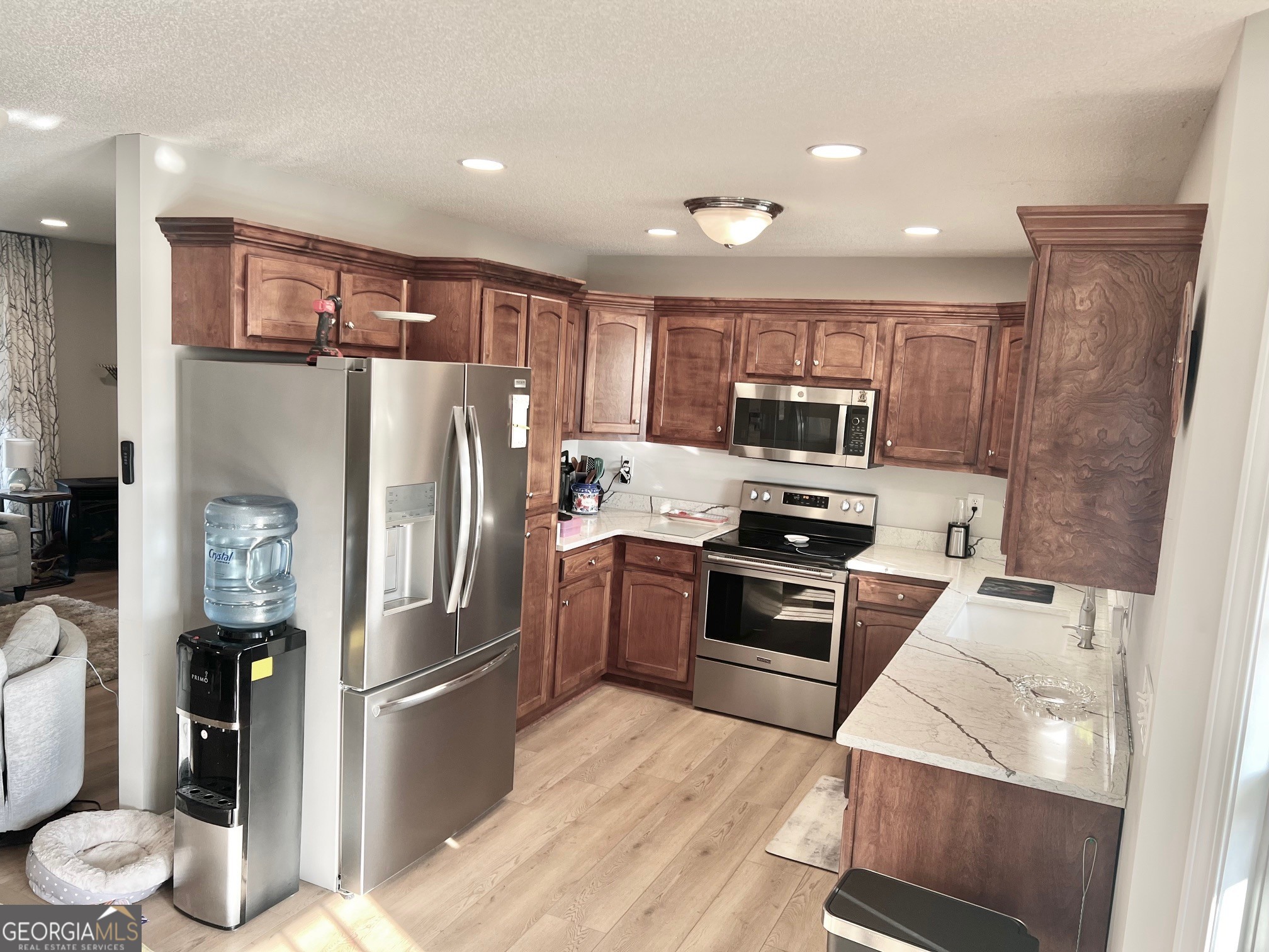 427 Chandler's Ridge Drive Chatsworth, GA 30705 - Photo 15 of 40 a kitchen with stainless steel appliances granite countertop a refrigerator and a stove