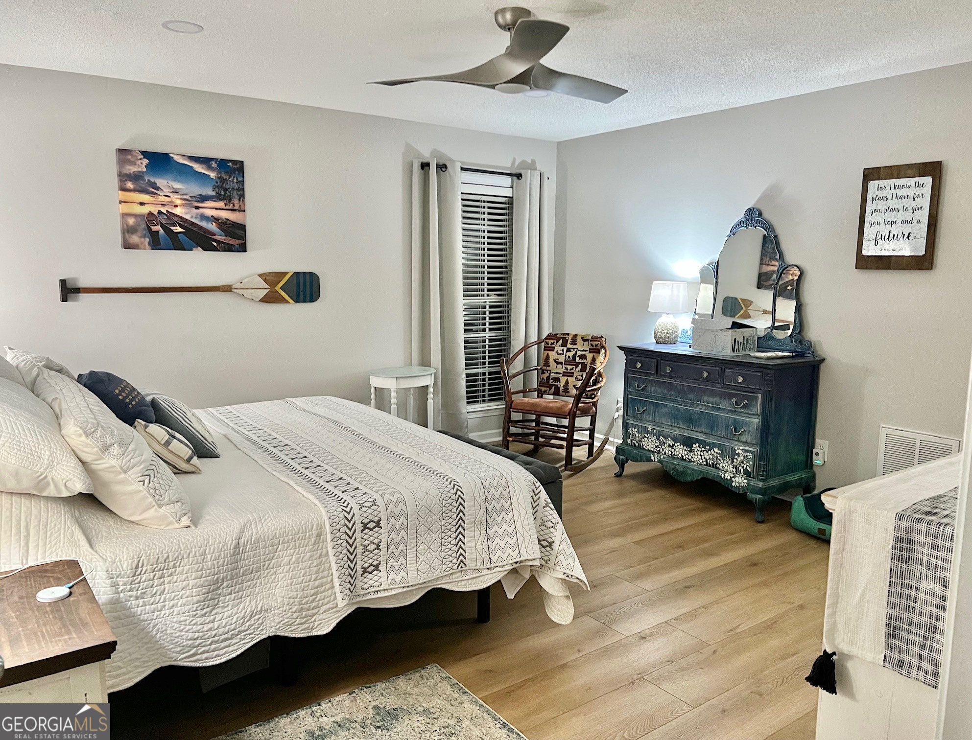 427 Chandler's Ridge Drive Chatsworth, GA 30705 - Photo 22 of 40 a bedroom with a bed and a chandelier