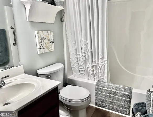 a bathroom with a sink and toilet