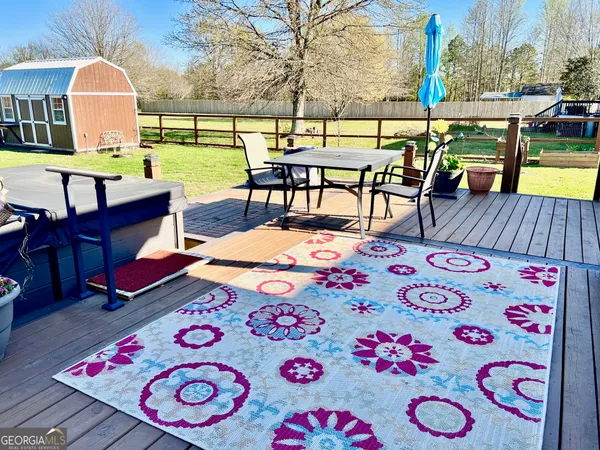 a view of a deck with furniture