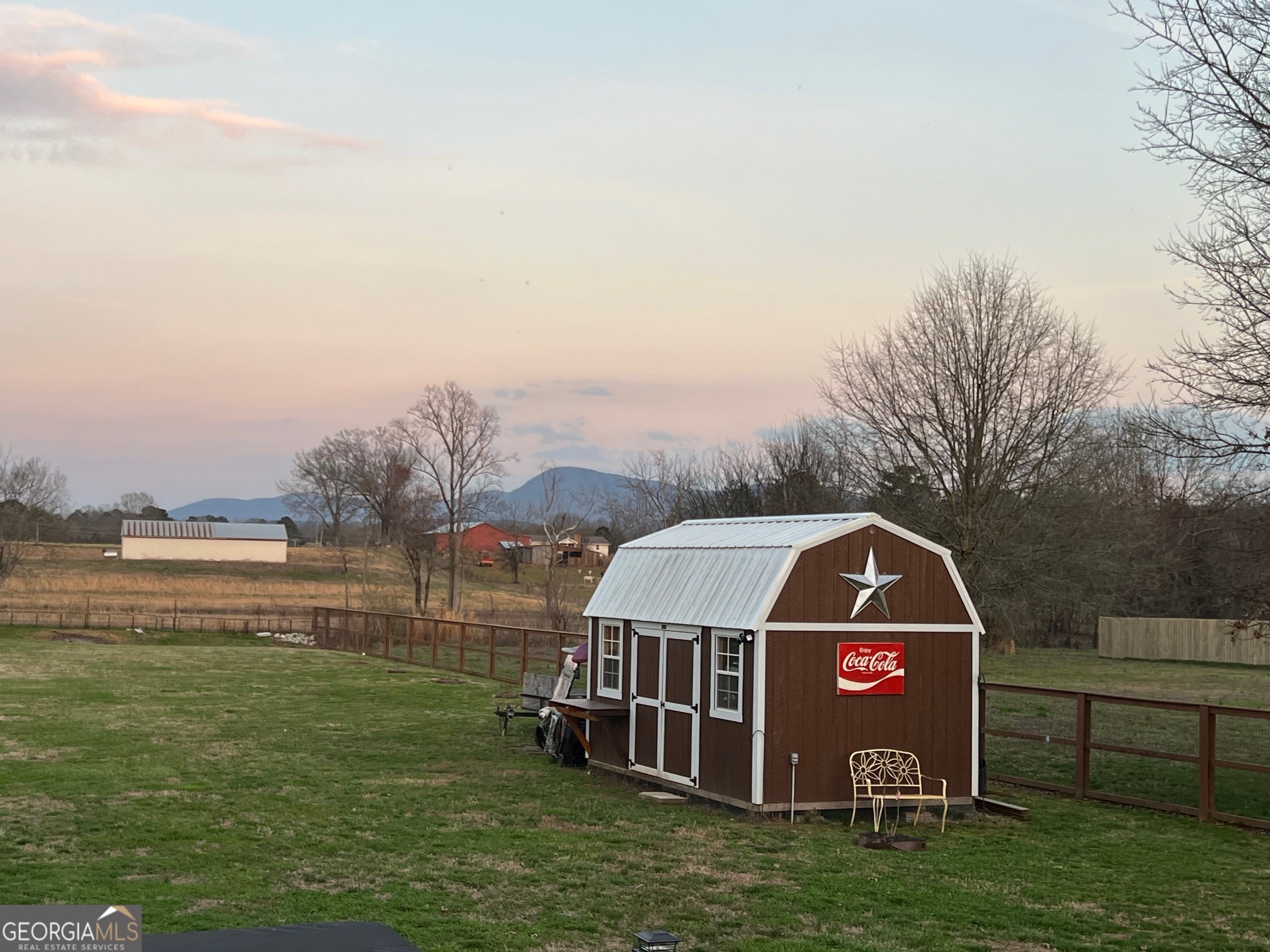 427 Chandler's Ridge Drive Chatsworth, GA 30705 - Photo 35 of 40 a view of a house with a yard next to a lake