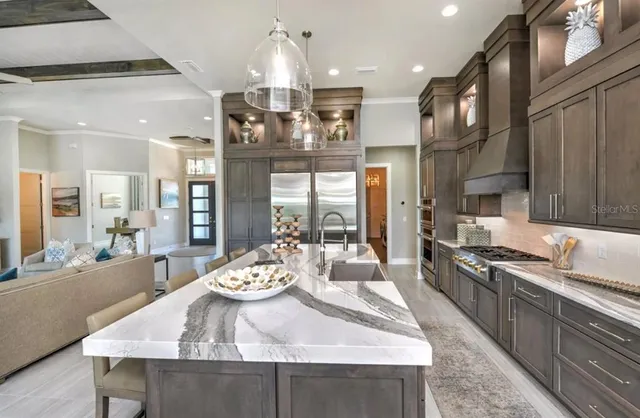 a large kitchen with a table and chairs