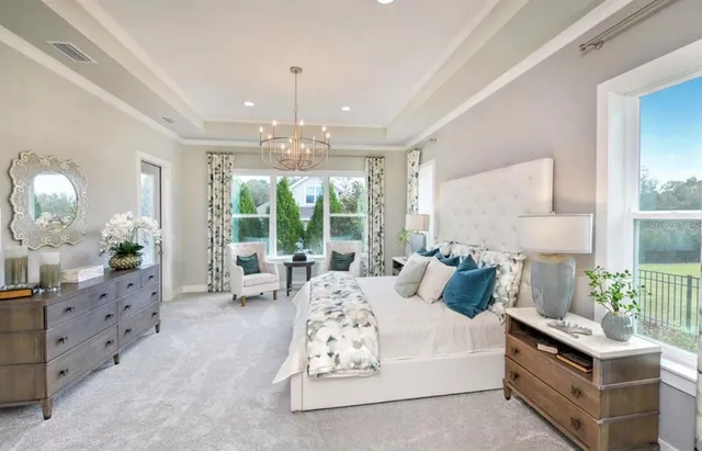 a bedroom with furniture and windows