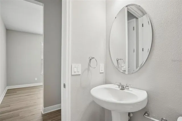 a bathroom with a sink and a mirror