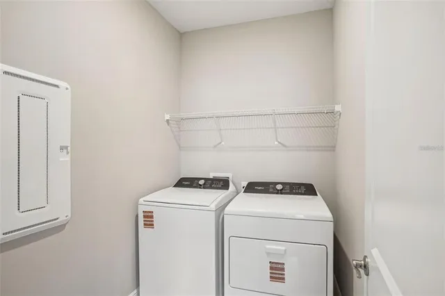 a utility room with dryer and washer