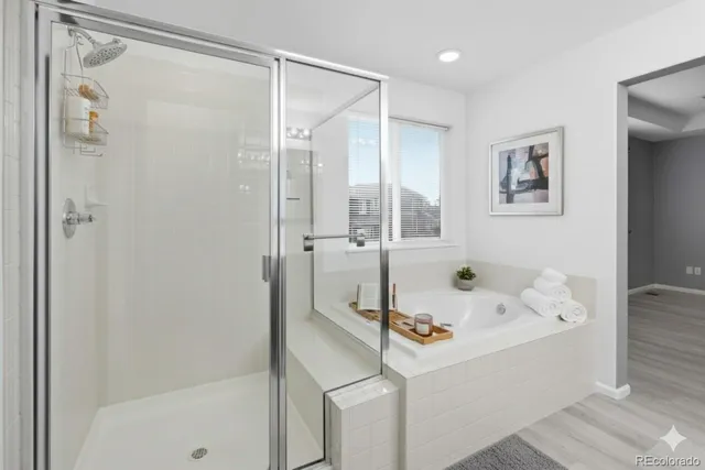 a bathroom with a tub and a shower