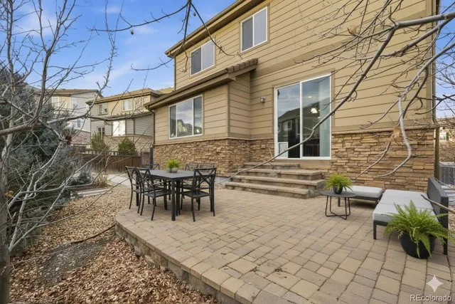 a picture of a very nice looking living room with a white refrigerator