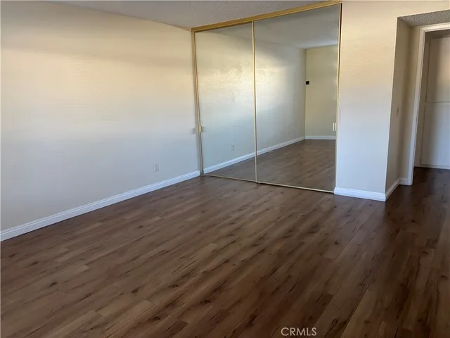 a bathroom with a granite countertop toilet a sink and bathtub