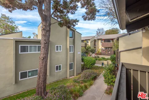a view of parking garage with cars