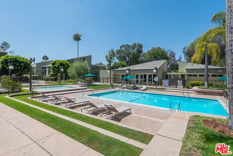 a view of swimming pool with chairs