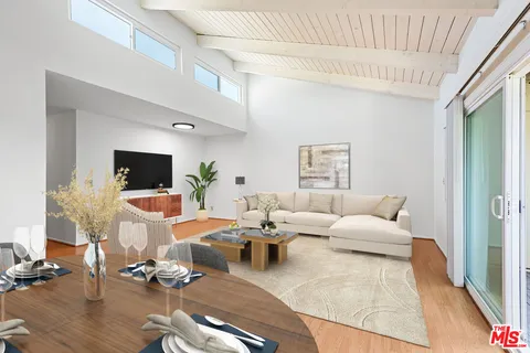 a living room with furniture or couch and a flat screen tv