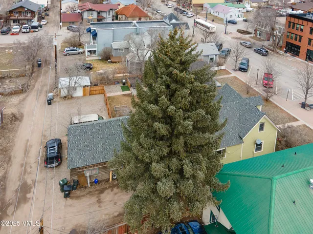 an aerial view of residential houses with outdoor space