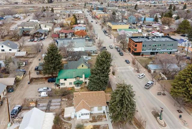 an aerial view of residential houses with outdoor space
