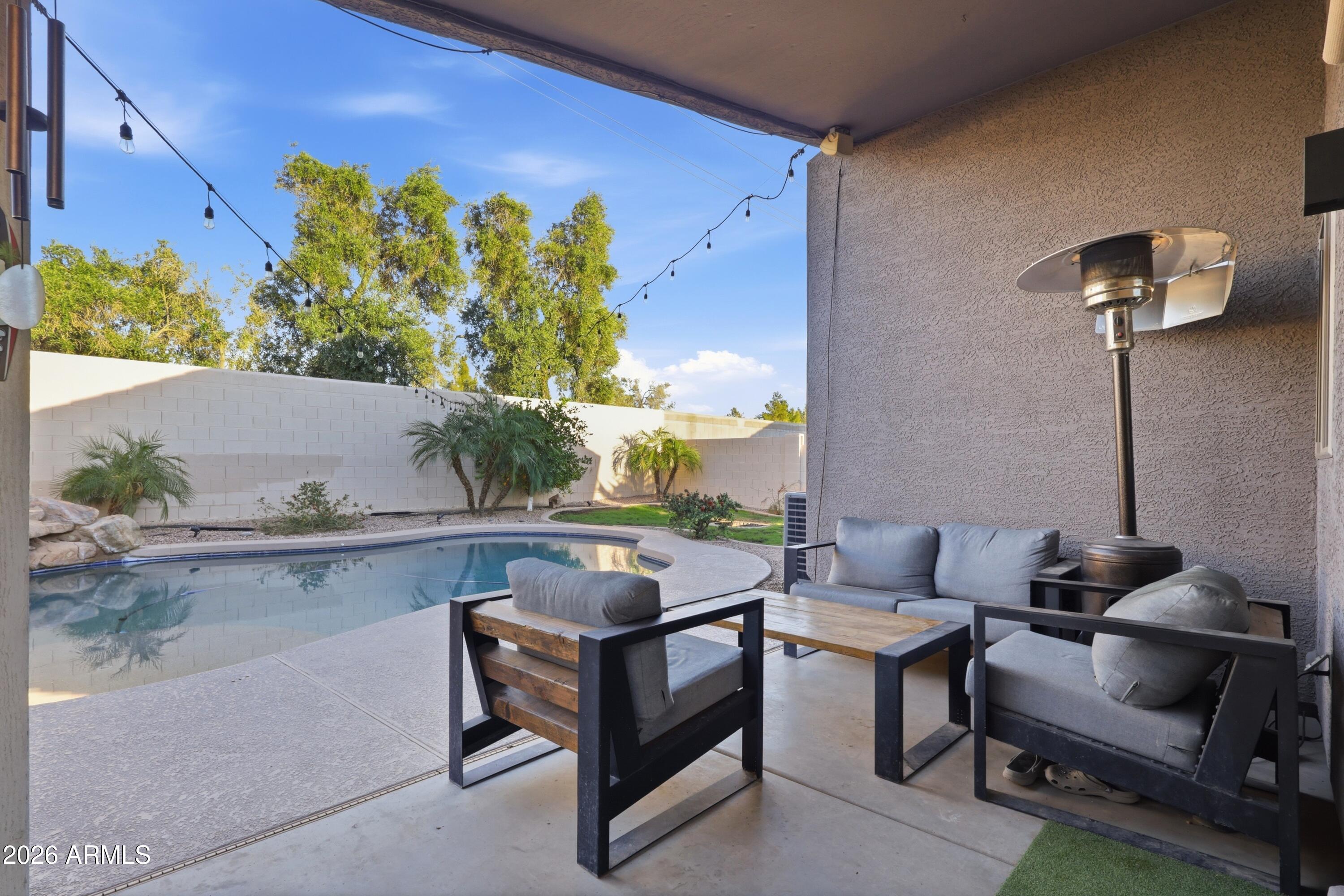 661 North Joshua Tree Lane Gilbert, AZ 85234 - Photo 30 of 47 a outdoor living space with furniture