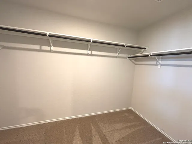 a view of a room with racks on the wall