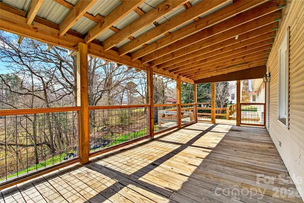 a view of a patio with wooden floor