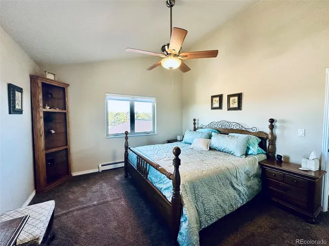a view of a livingroom with stairs and furniture