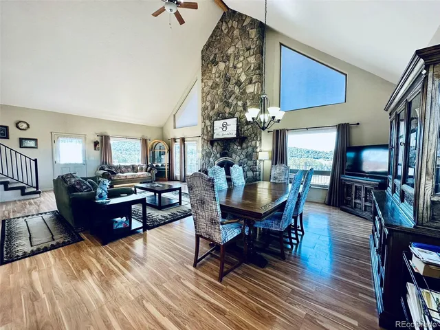 a living room with lots of furniture and a rug