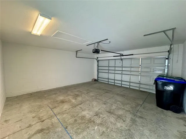 a view of a utility room with closet and windows