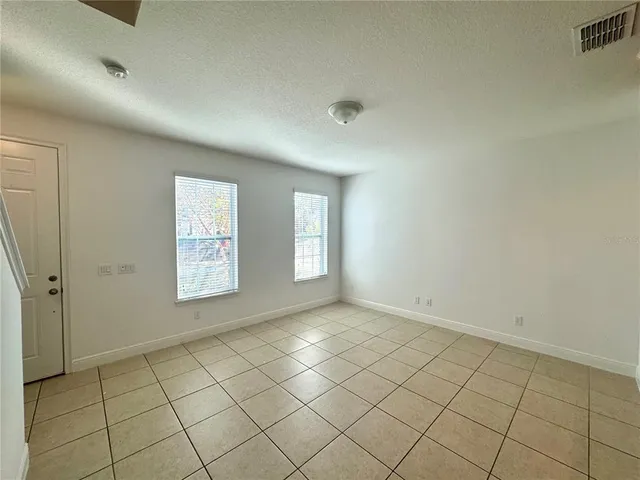 a view of an empty room and window