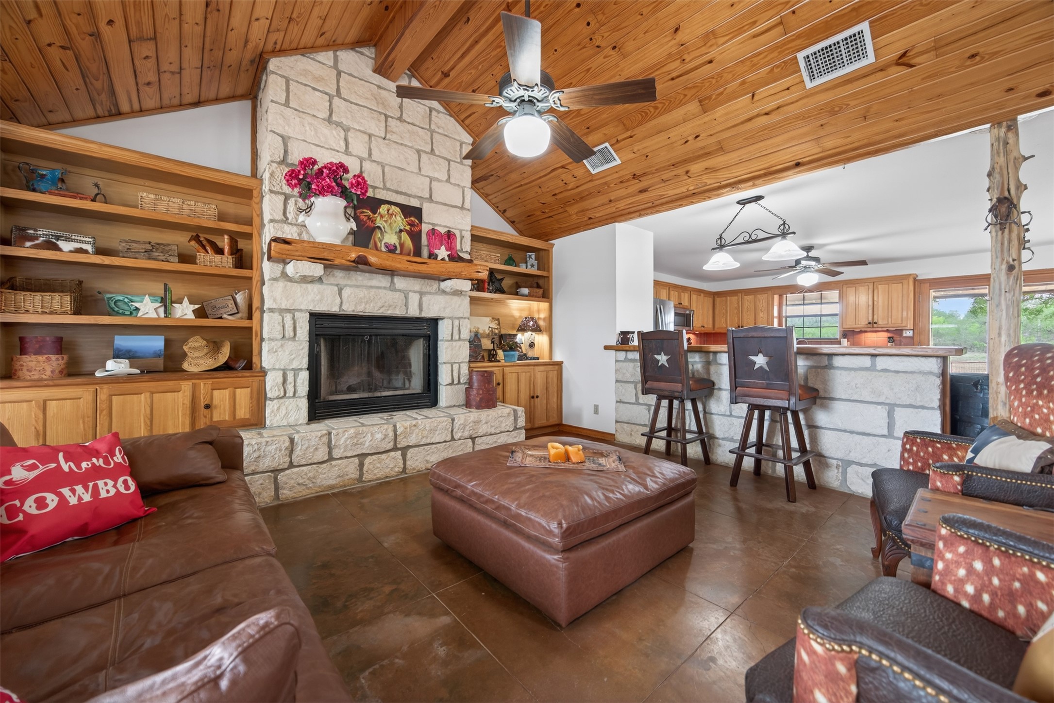 1077 Burdette Wells Road Lockhart, TX 78644 - Photo 12 of 38 a living room with furniture and a fireplace